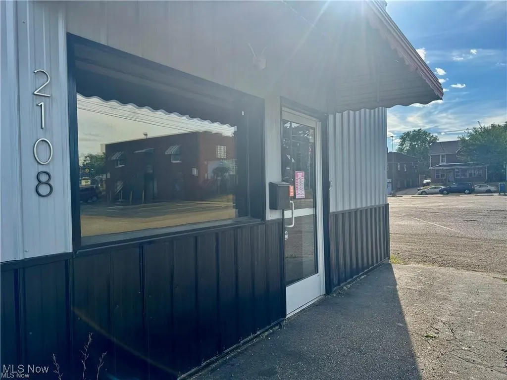 View of exterior entry featuring a porch