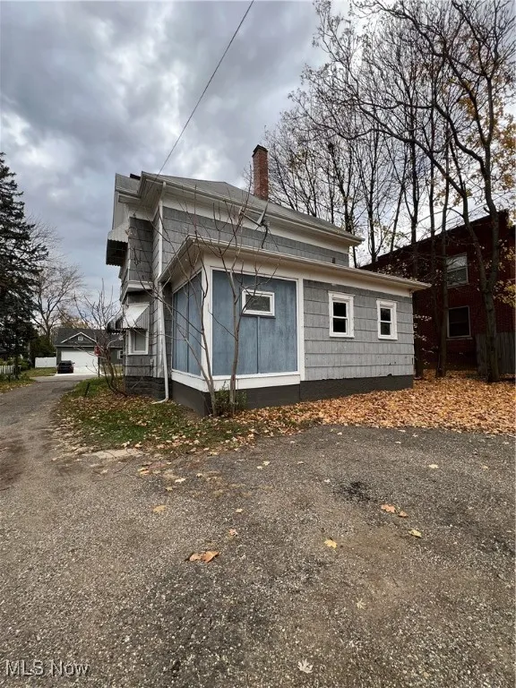 View of home's exterior with a chimney