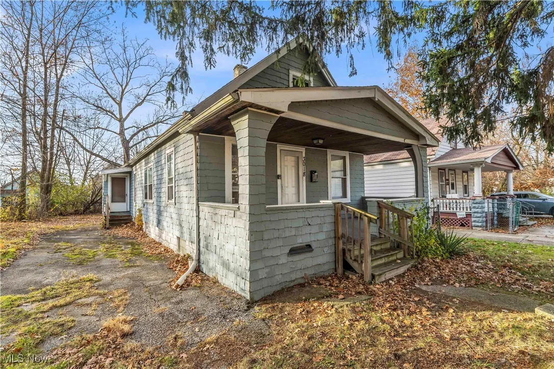 Shotgun-style home with a chimney