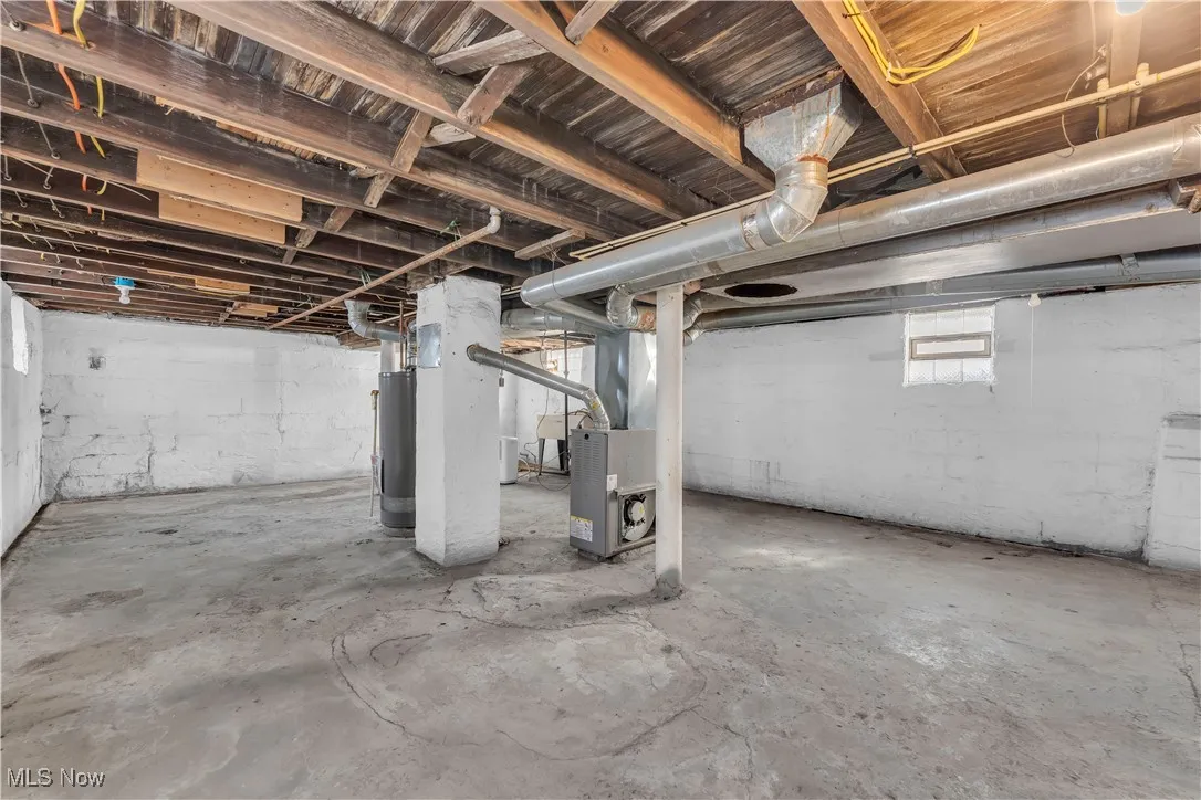 Below grade area with water heater and heating unit