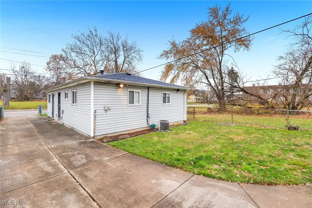 View of side of property featuring a central air condition unit
