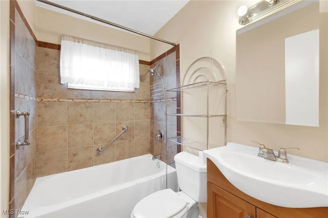 Full bathroom with vanity and tub / shower combination