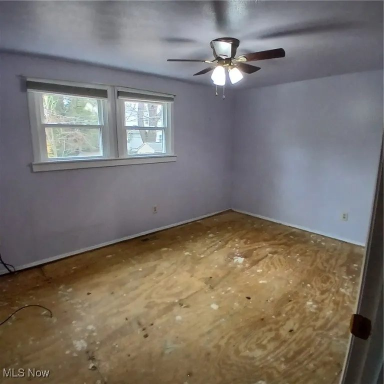 Empty room with a ceiling fan
