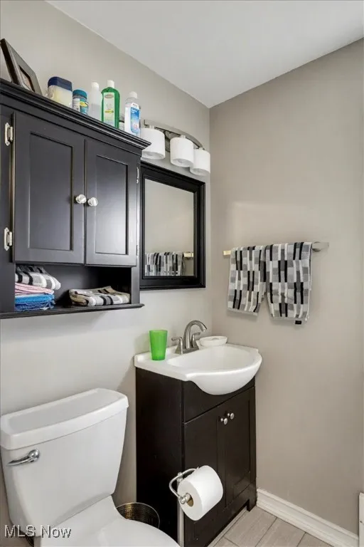 Bathroom featuring vanity and toilet