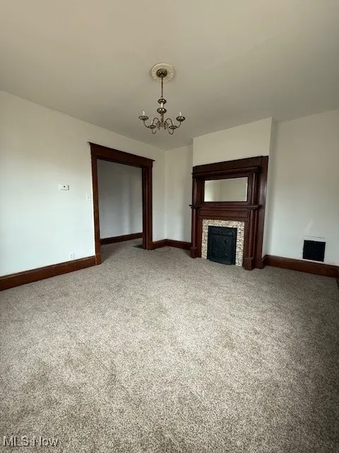 Decorative fireplace and pocket doors with new carpet