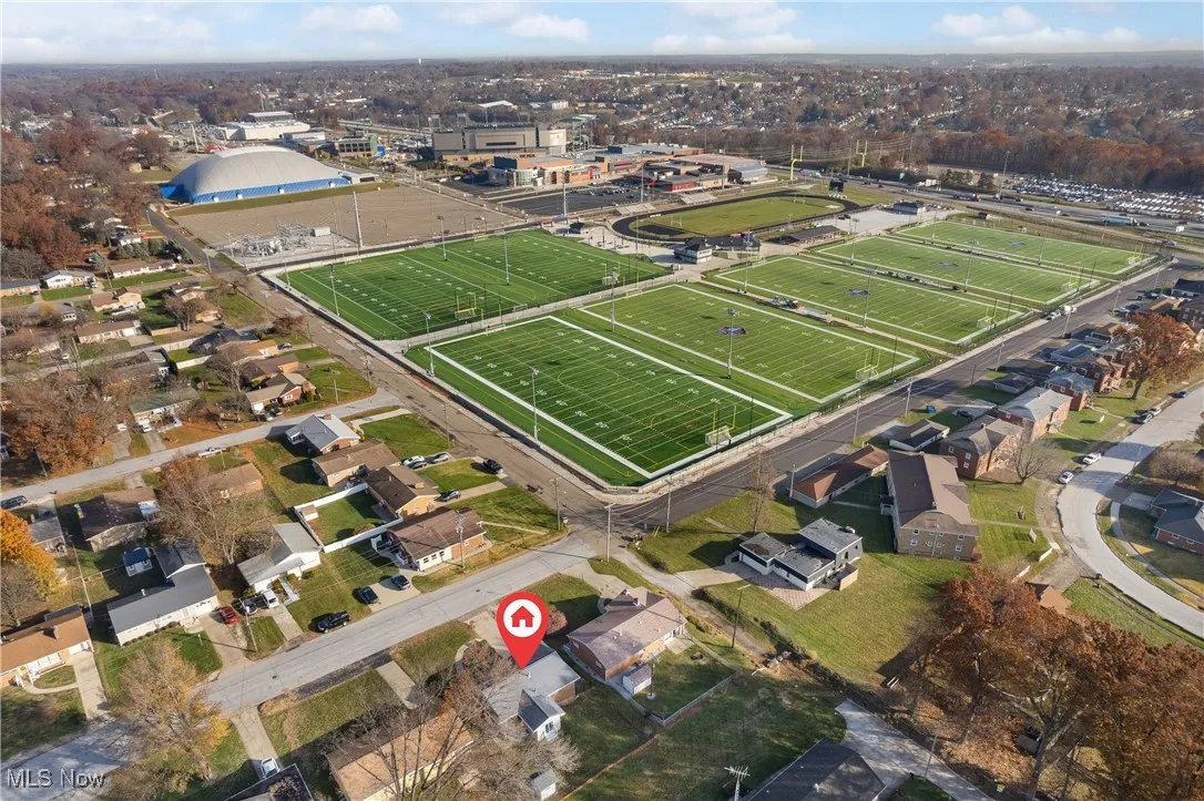 Aerial overview of property's location with nearby suburban area