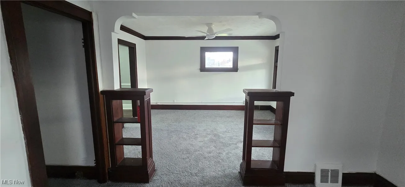 2nd level living and dining room -  dark carpet and baseboards