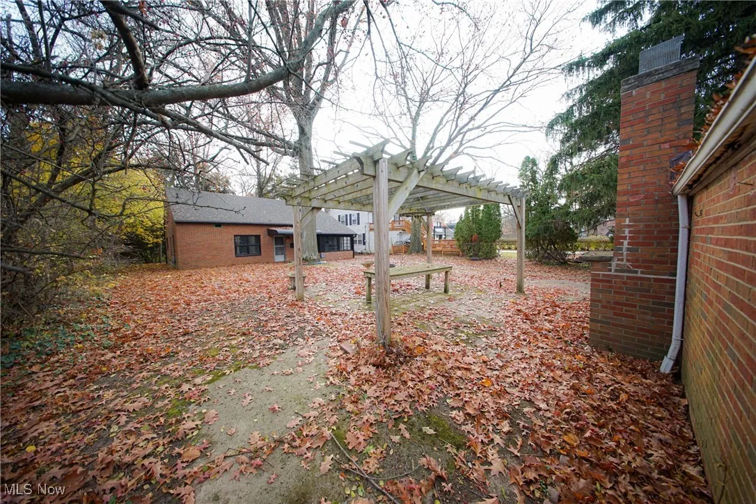 View of yard featuring a pergola
