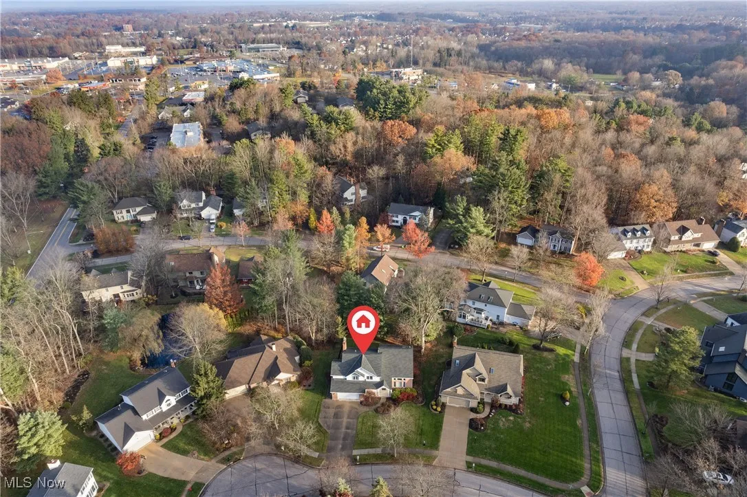 Aerial overview of property's location with nearby suburban area
