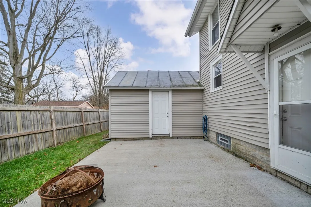 View of patio featuring an outdoor fire pit
