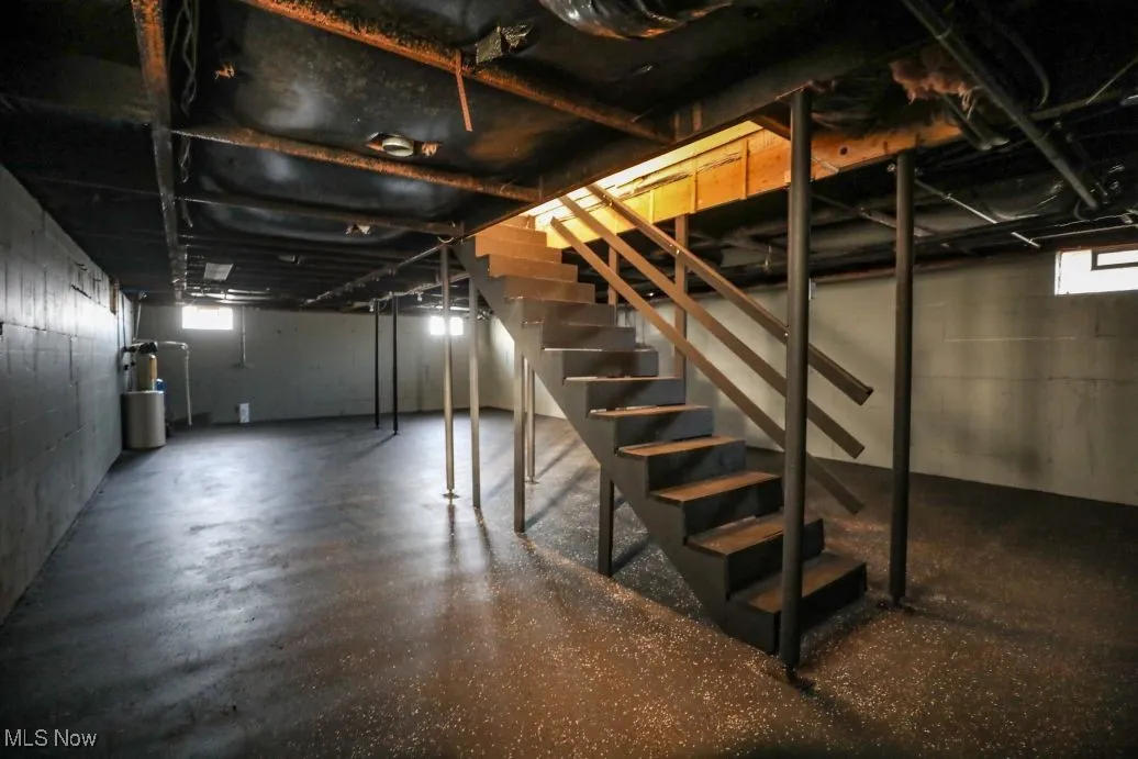 Basement featuring stairs