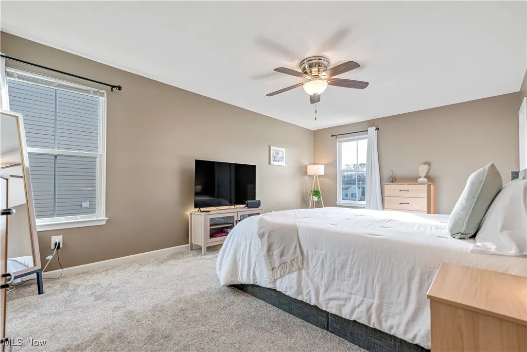 Large Primary Bedroom has a ceiling fan