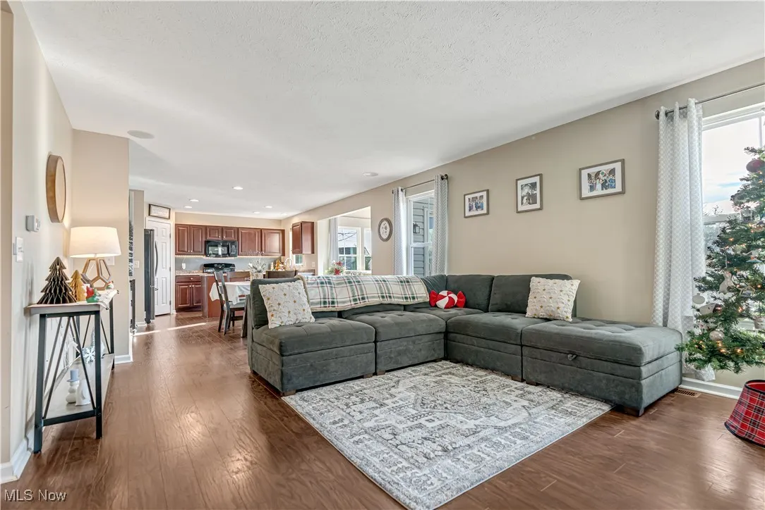 Living Room with dark luxury vinyl floors and recessed lighting