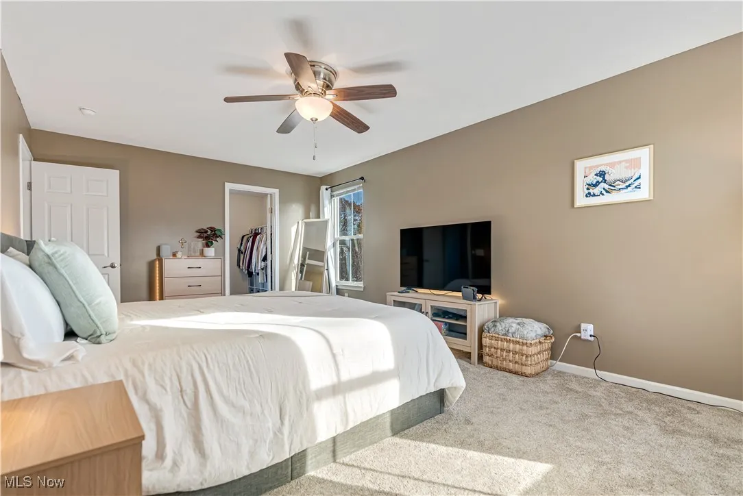 Primary Bedroom featuring a walk in closet