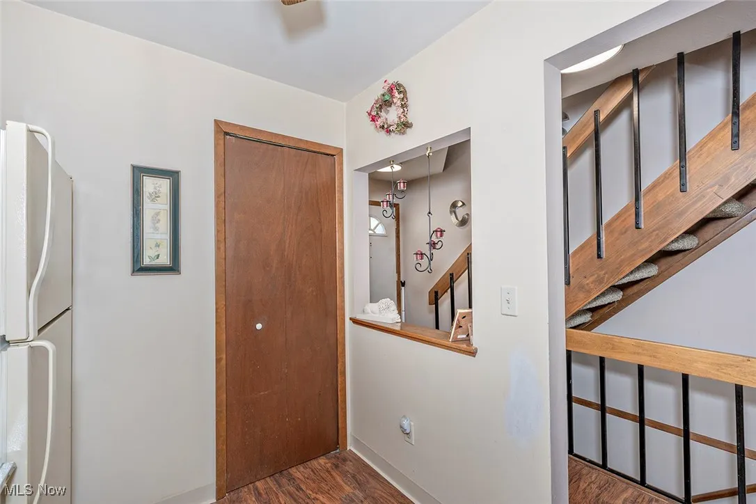 Hall featuring wood finished floors and baseboards