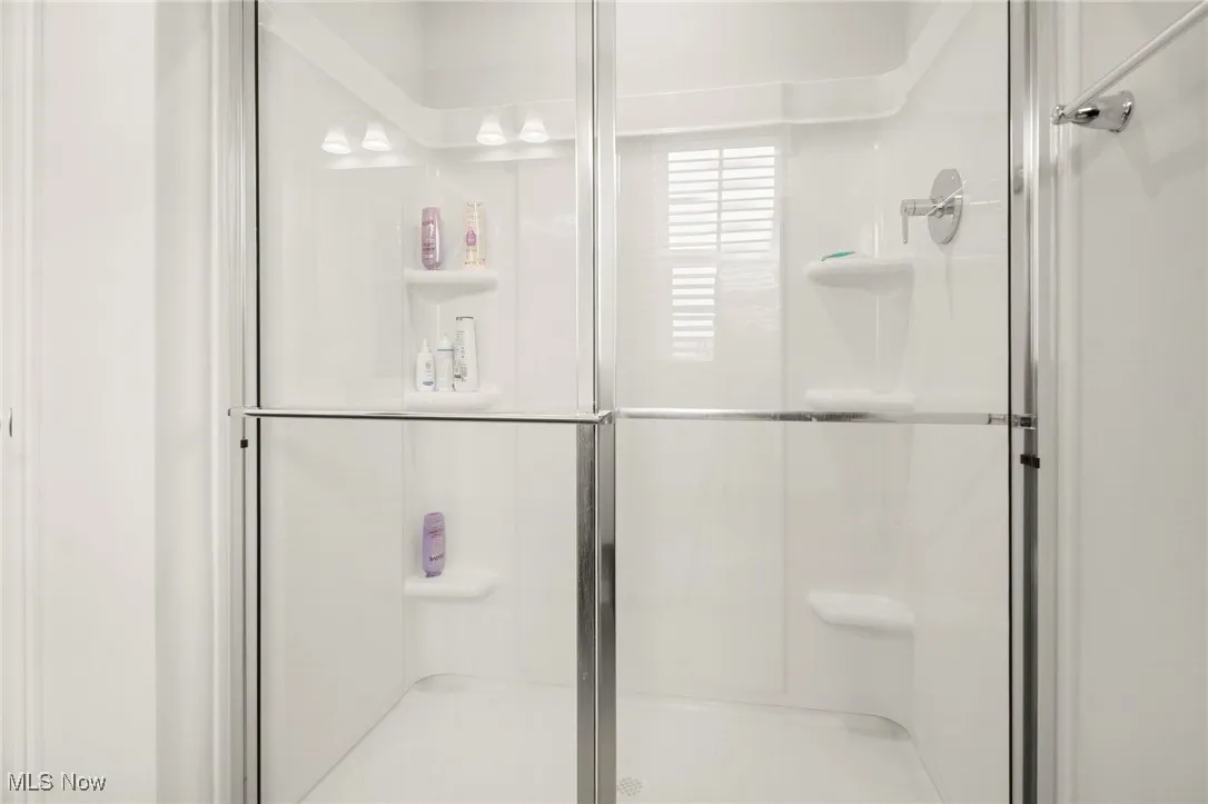 Bathroom featuring a shower stall