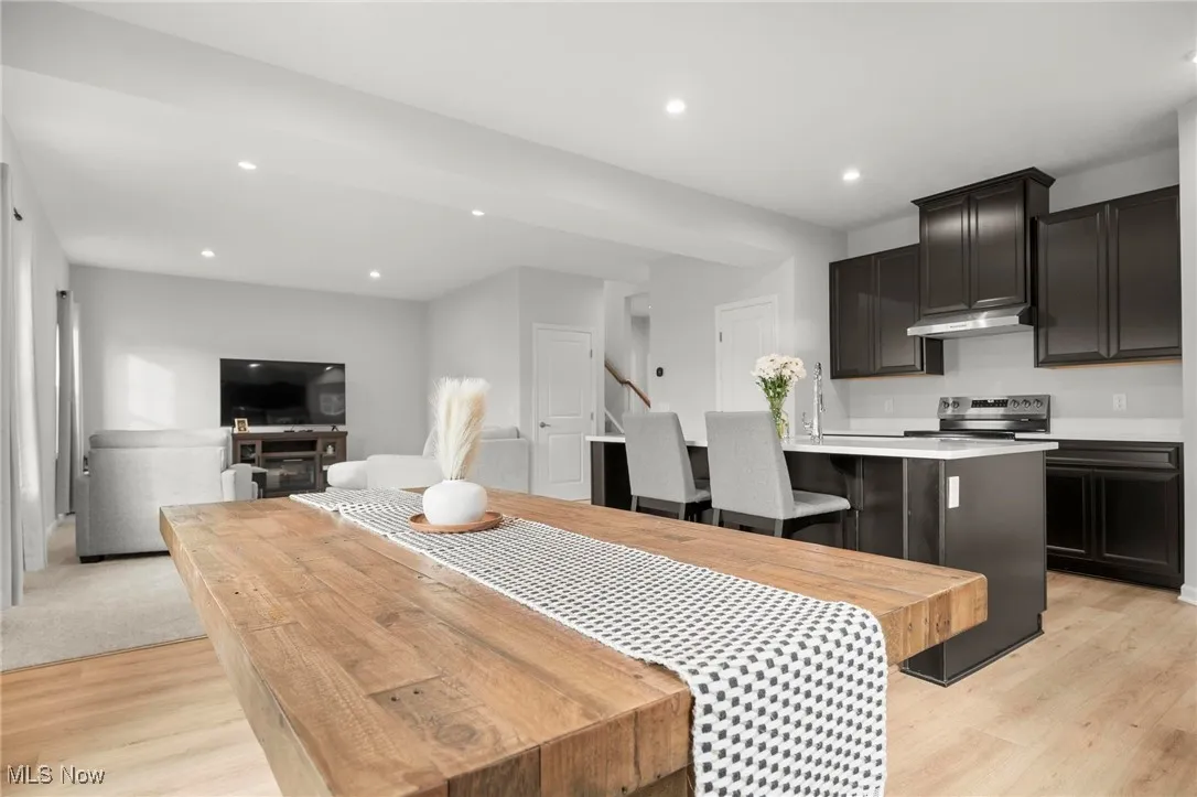 Dining space featuring recessed lighting and light wood finished floors