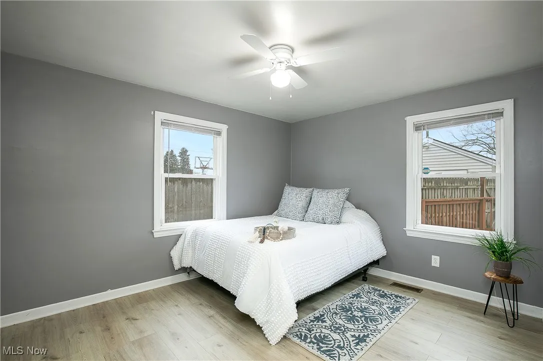 Bedroom featuring light wood-type flooring and a ceiling fan