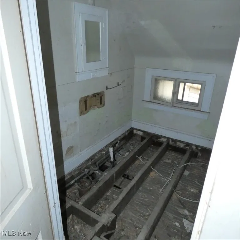 Bathroom featuring vaulted ceiling