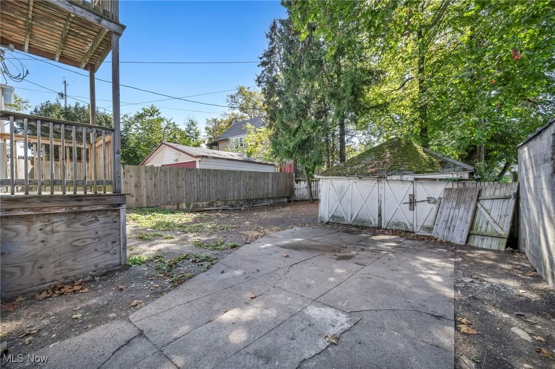 Fenced backyard featuring a gate
