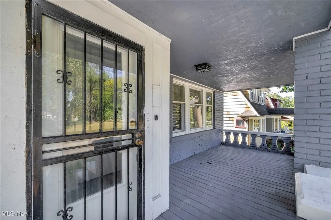 View of exterior entry with brick siding