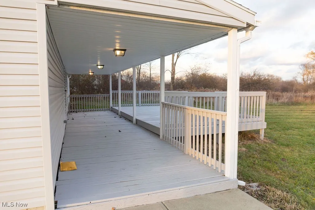 Wooden deck featuring a yard