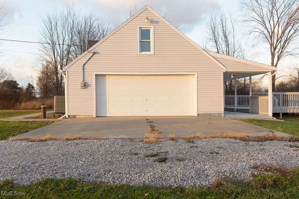 Garage featuring driveway