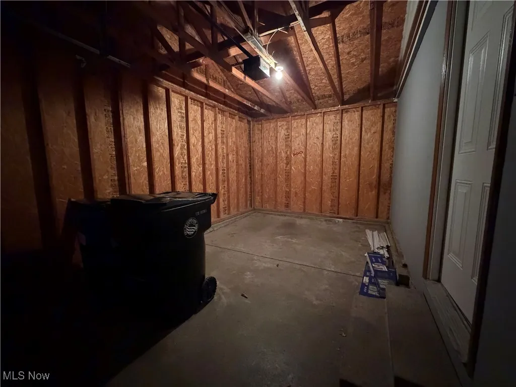 Basement with a garage and a sauna / steam room