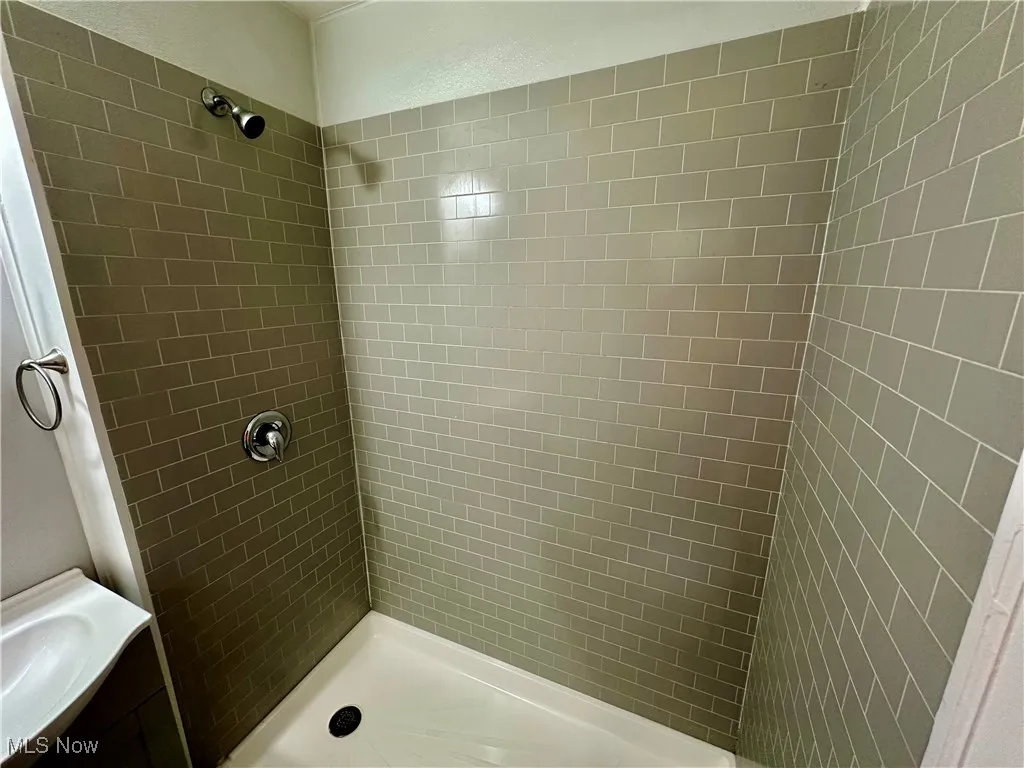 Bathroom with a shower stall and vanity