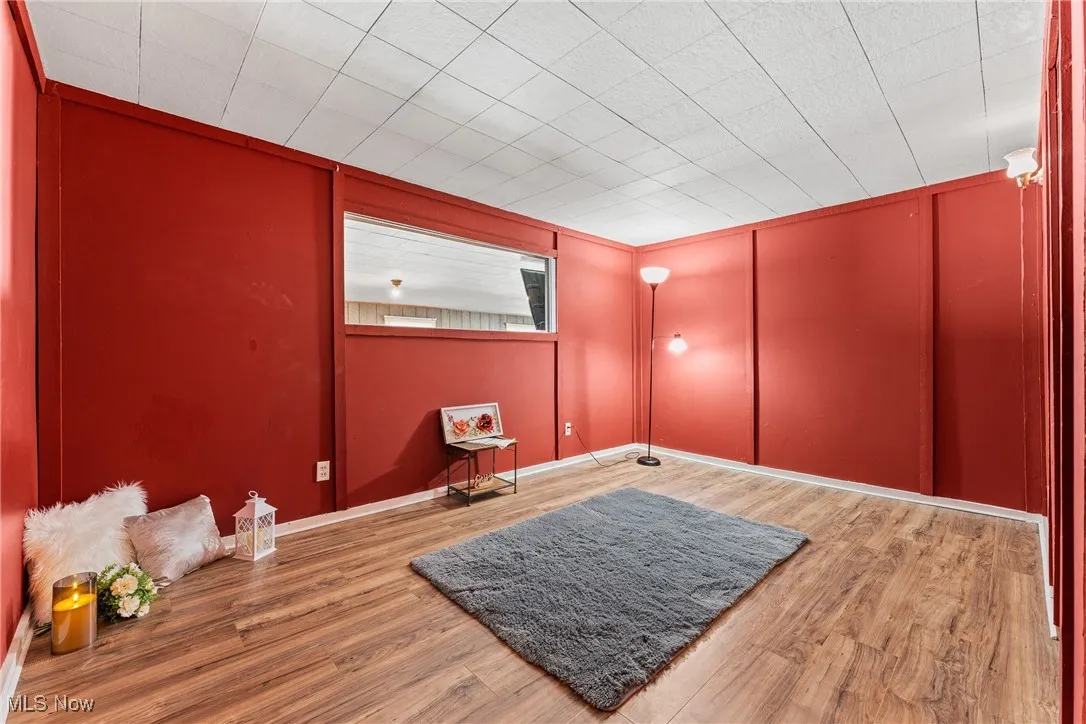 Empty room featuring light wood-style flooring and baseboards