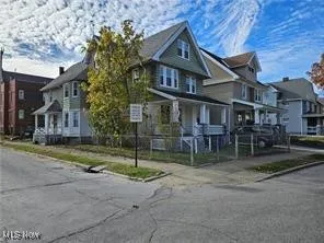 View of the front of house of both units and porches
