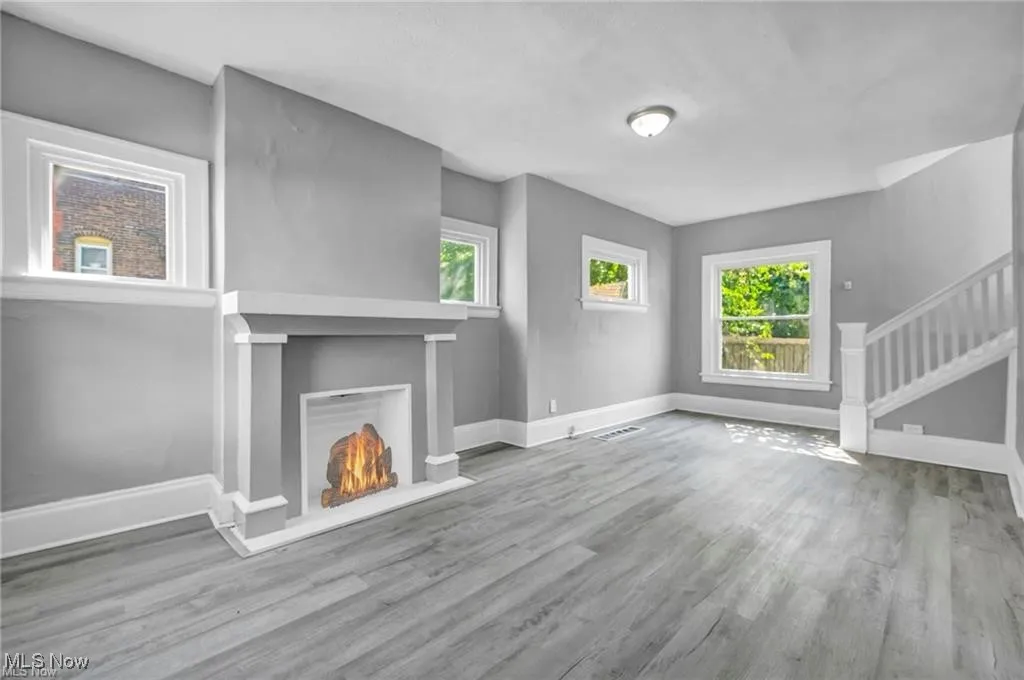 Unfurnished living room with wood-type flooring