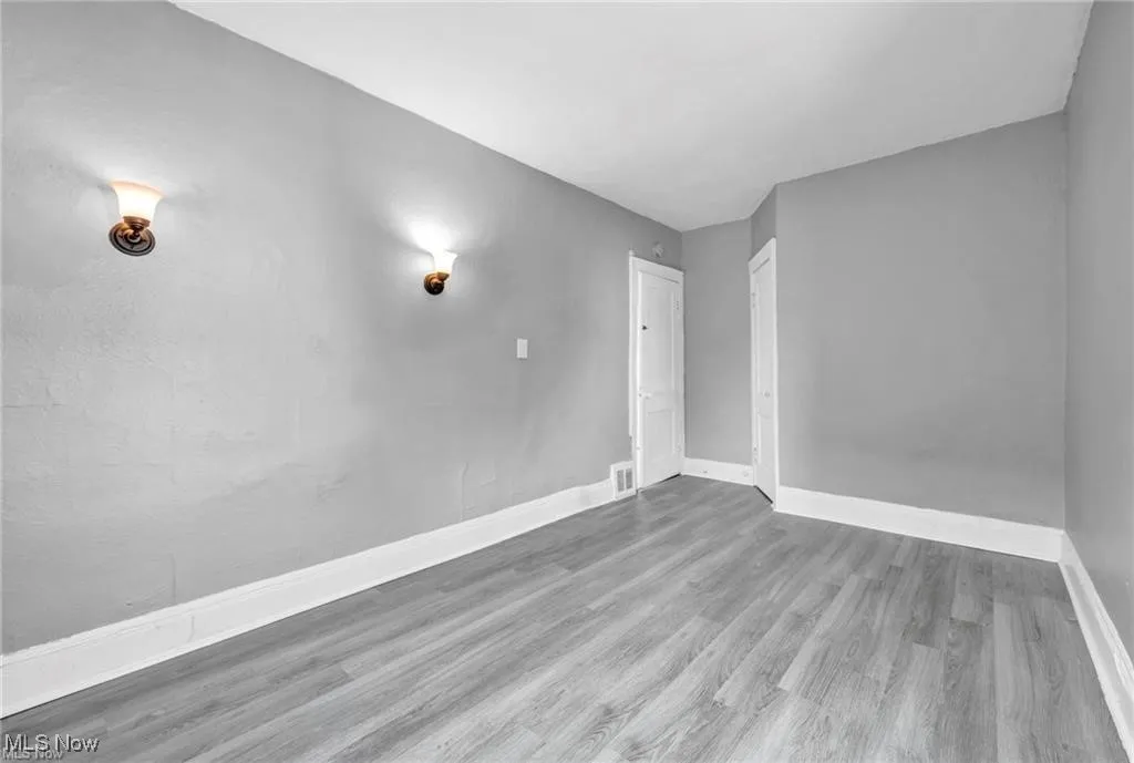 Unfurnished room with hardwood / wood-style floors