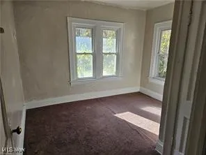 Unfurnished bedroom featuring carpet floors