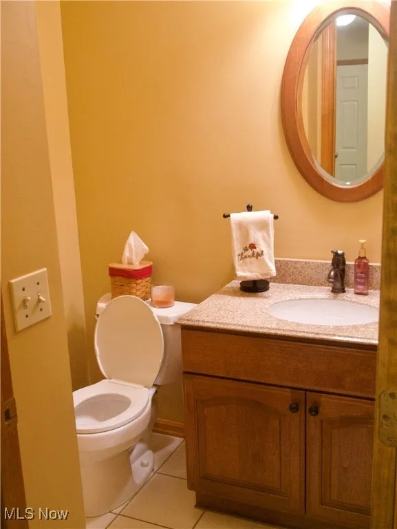Bathroom featuring vanity and light tile patterned floors
