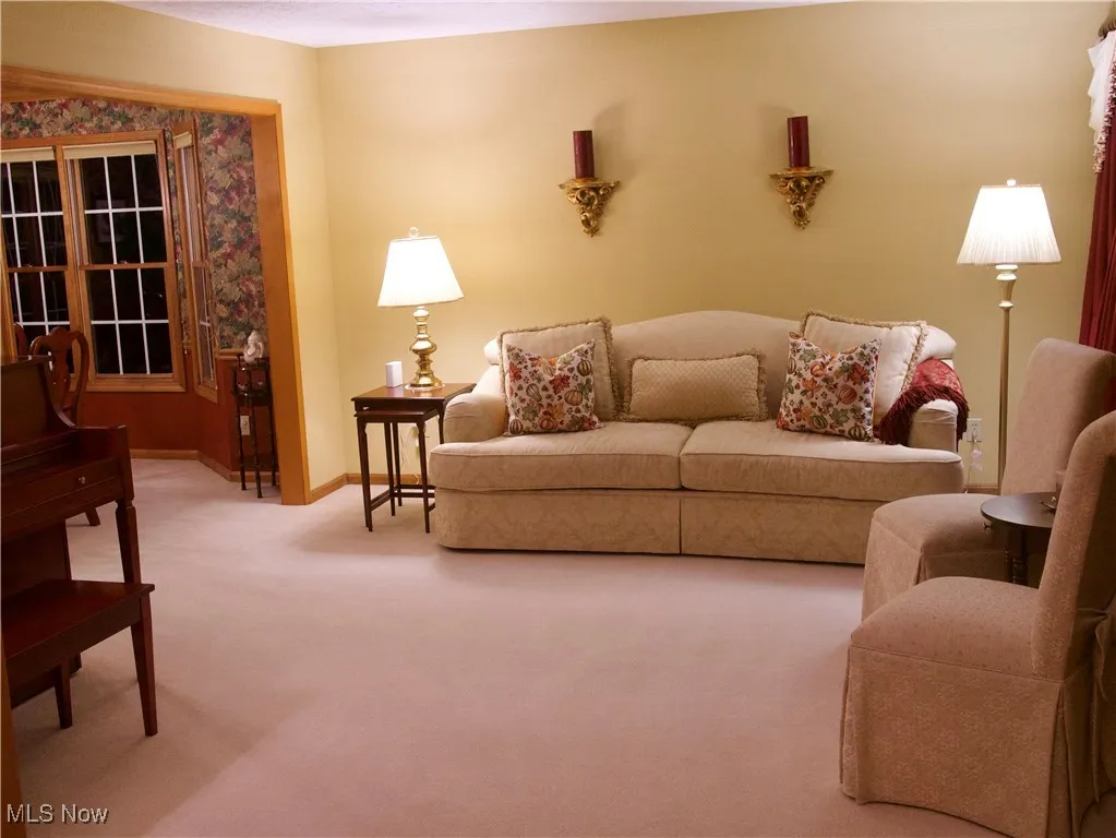 Living area with carpet floors and baseboards