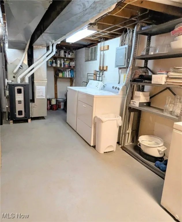 View of Laundry Area, Storage, 200 Amp Electric and New Furnace. Washer, Dryer, Freezer, Shelving Stay