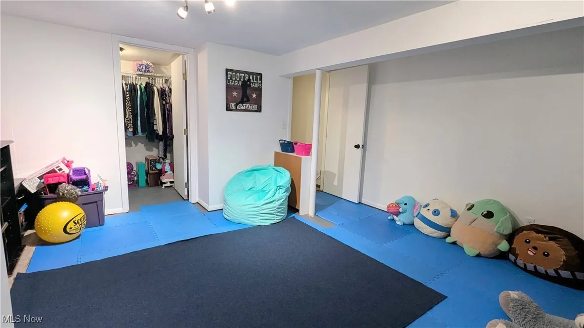 View of 4th Bedroom, Office, Play or Exercise Room with Large Walk In Closet, Modern Paint, Interlocking Flooring and Window Treatment