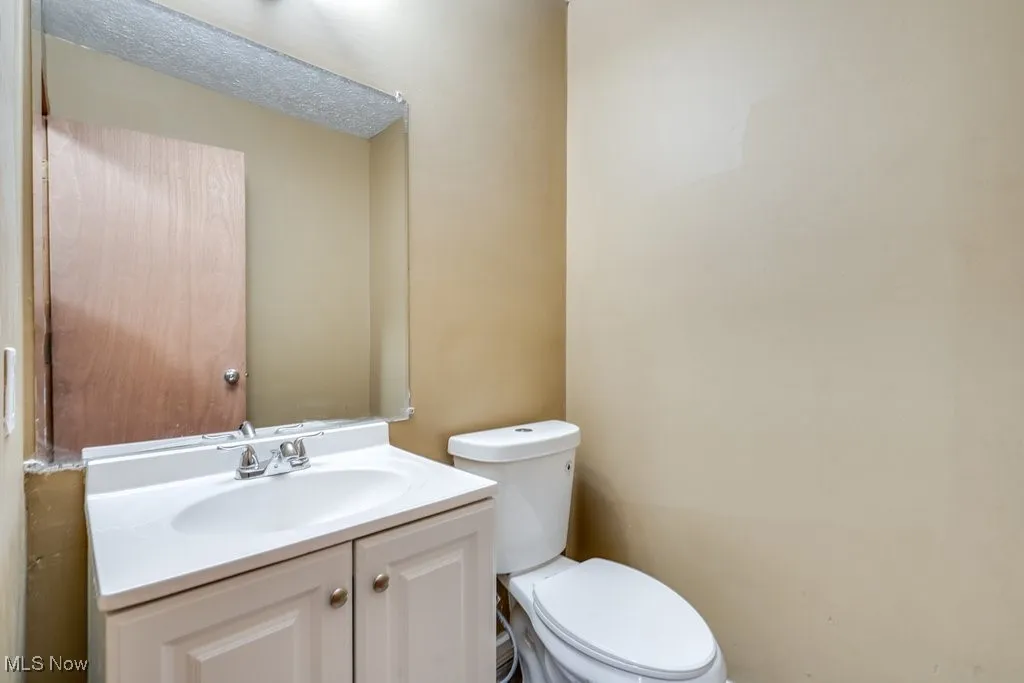 Bathroom with vanity and toilet
