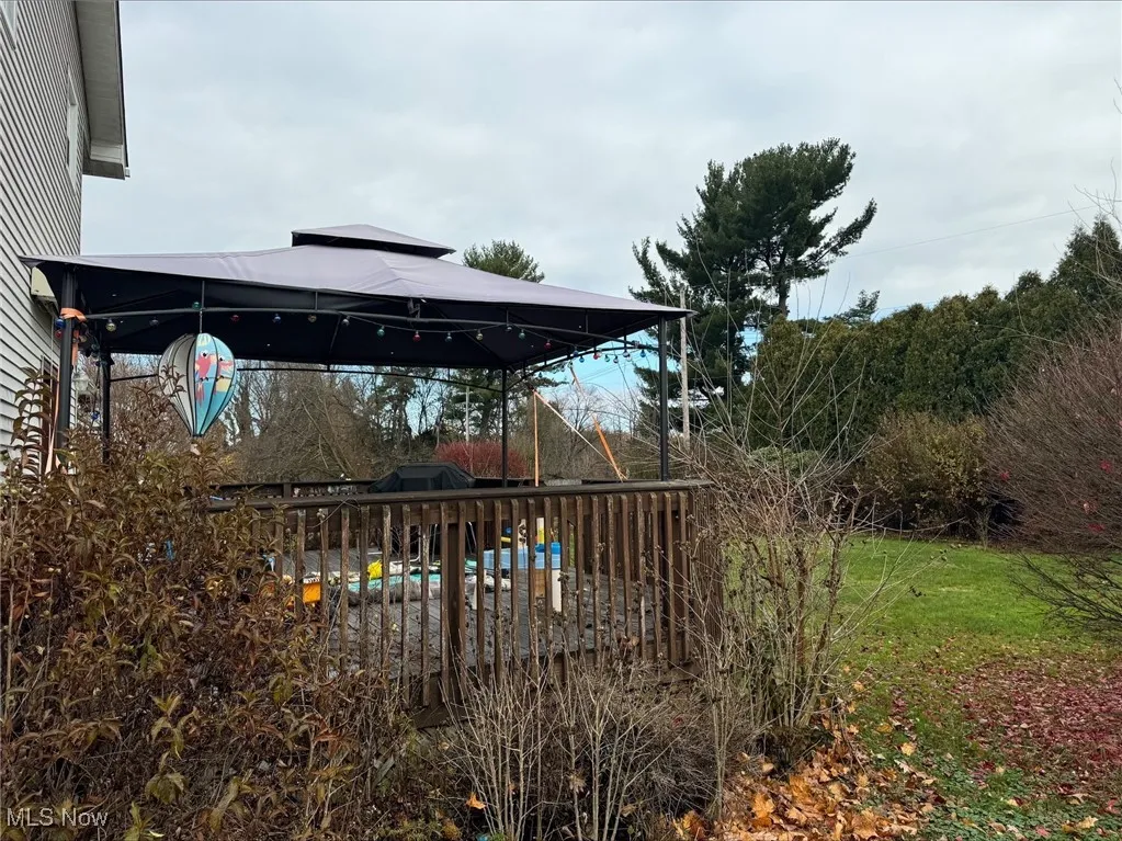 View of yard with a gazebo and a deck