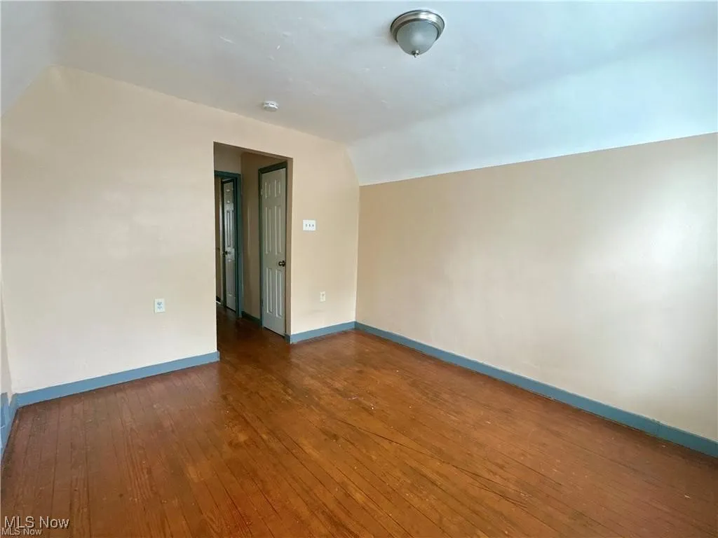 Upstairs bedroom with wood flooring