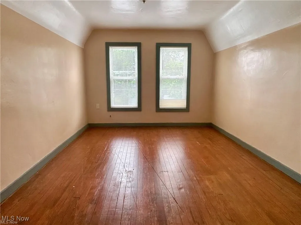 Upstairs bedroom with wood flooring