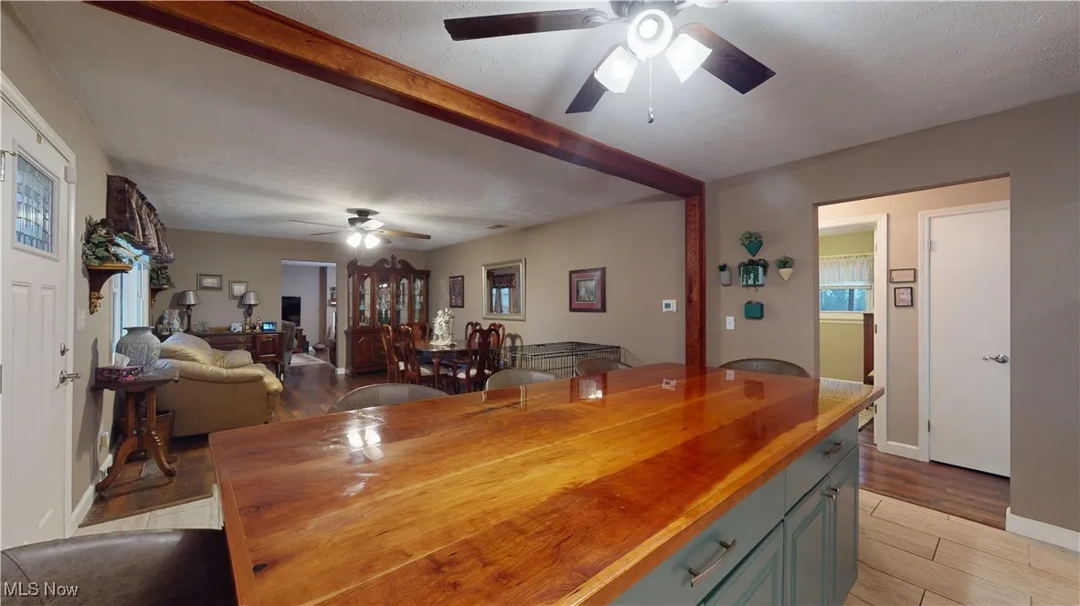 WOOD ACCENT AROUND OPENING INTO KITCHEN