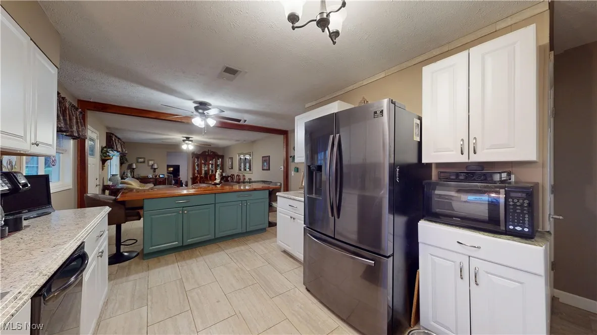 ENTRANCE TO SIDE PORCH FROM KITCHEN