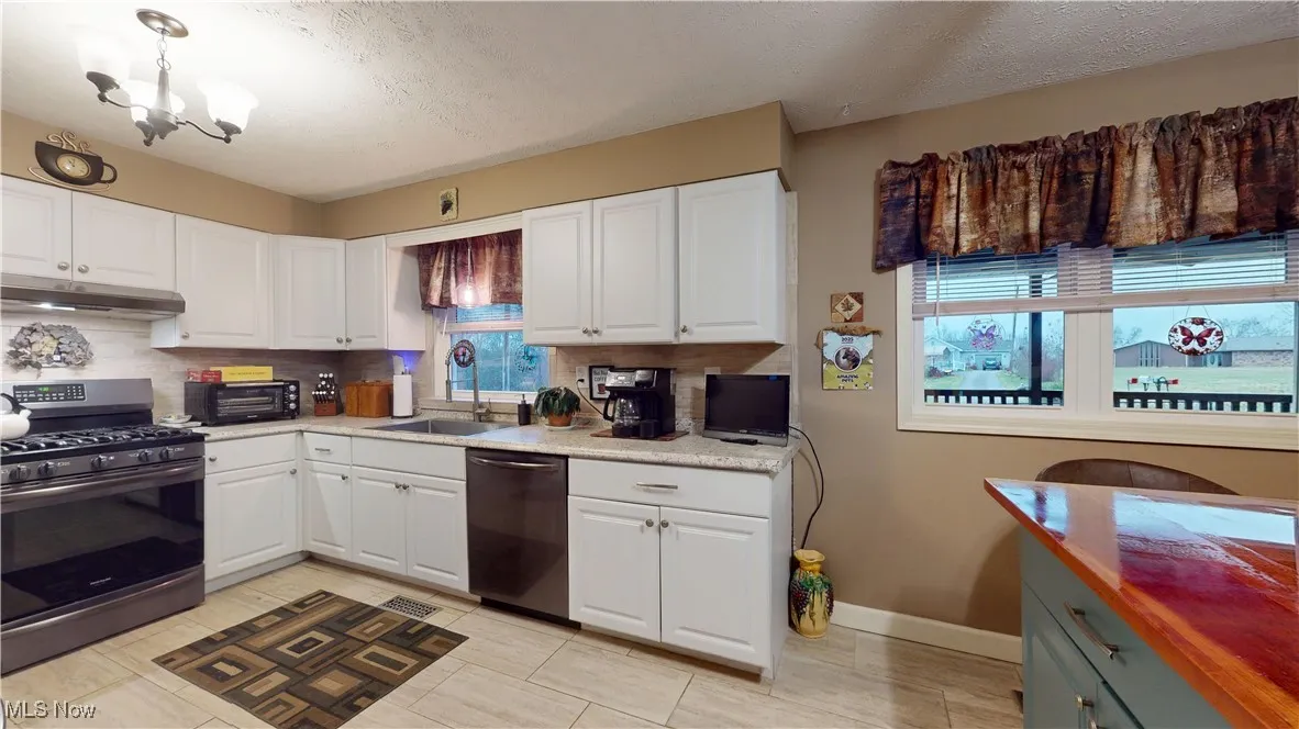 WINDOWS IN KITCHEN OVERLOOKING FRONT PORCH