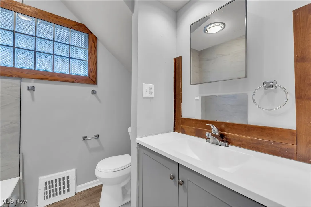 Bathroom with vanity and toilet