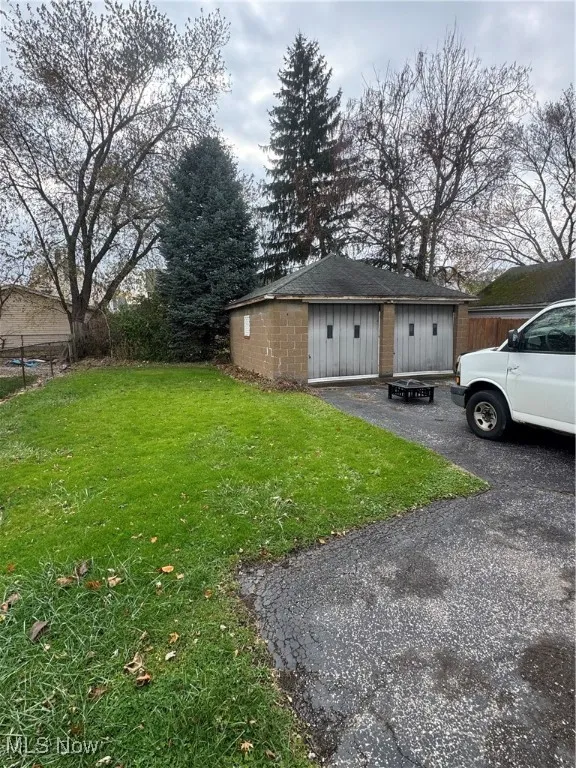 View of home's exterior featuring an outdoor structure