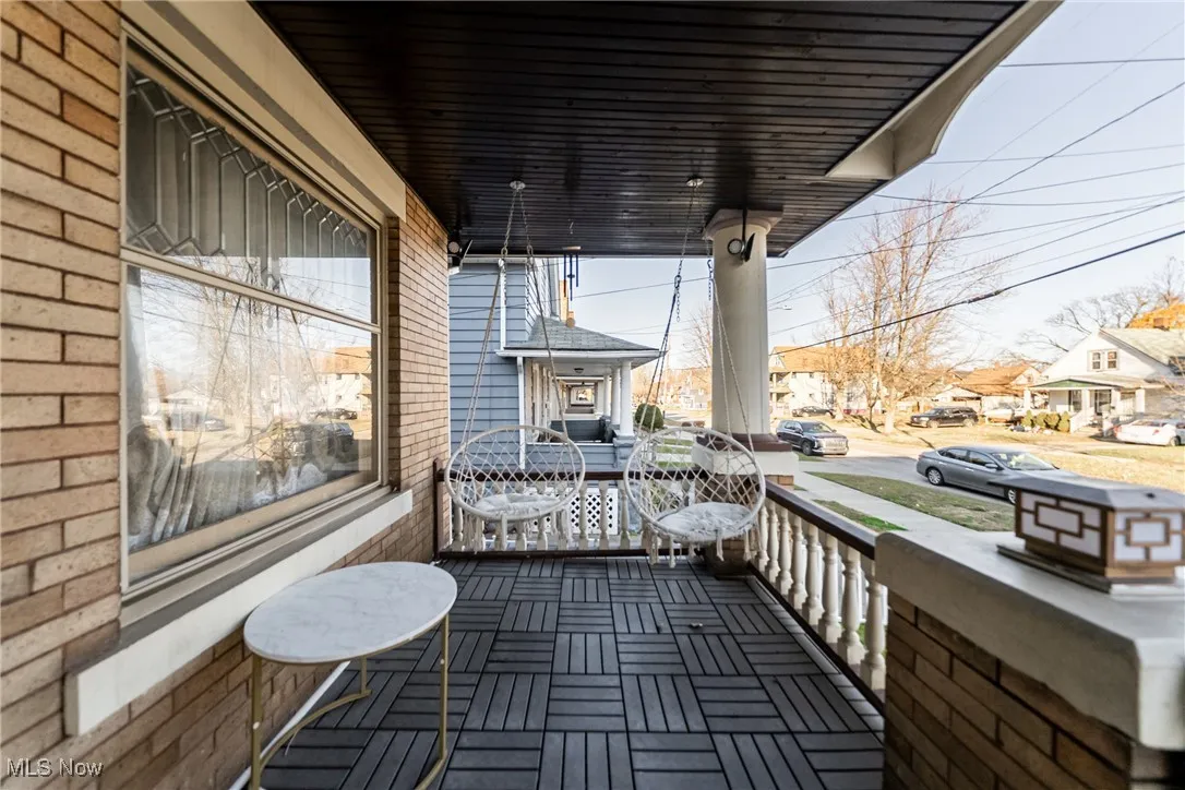 Wooden porch with a residential view