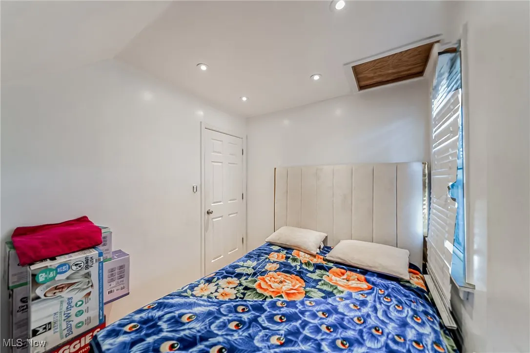 Bedroom featuring recessed lighting and lofted ceiling