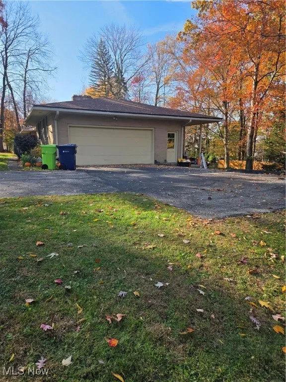 View of property exterior featuring driveway